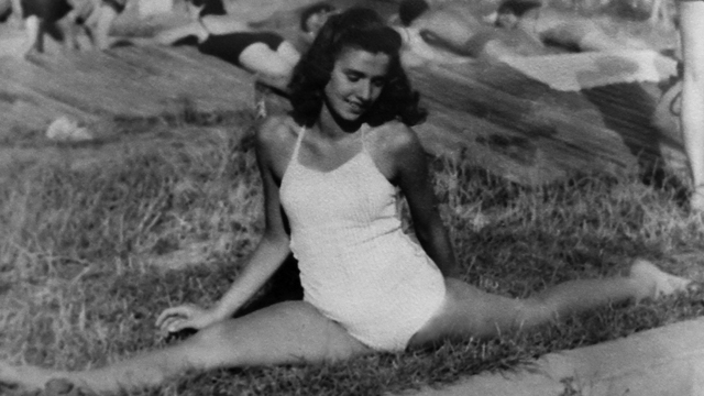 Edith at age 14 showing off her gymnast talent for her friends. Trained as a gymnast and ballet dancer, Edie’s hopes of competing at the Olympic Games were quashed when her coach was forced to choose a non-Jewish athlete to take her place. Credit: The private collection of Dr. Edith Eva Eger
